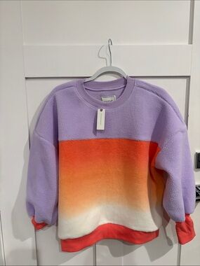 Anthropologie Lavender Fleece Crewneck with Orange-to-Cream Ombre Panel